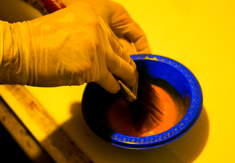 Gum arabic, potassium dichromate, and a powdered earth mineral are weighed and mixed.